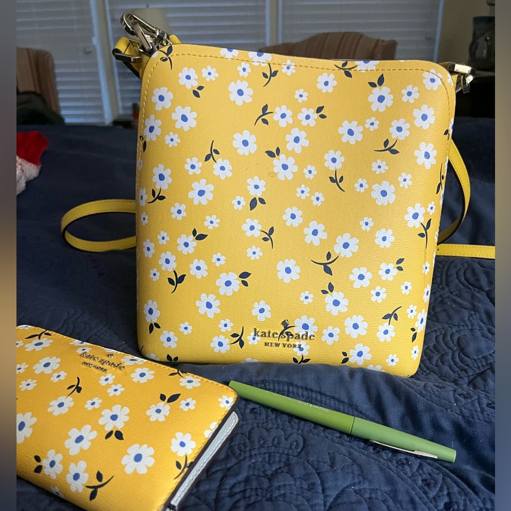 Kate Spade yellow with blue and white flowers purse.